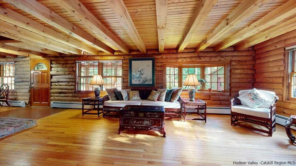 296 Bush Road Stone Ridge, NY 12484 - Photo 10 of 27 a living room with furniture and a wooden floor