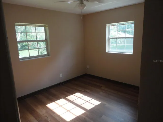 a view of an empty room and window