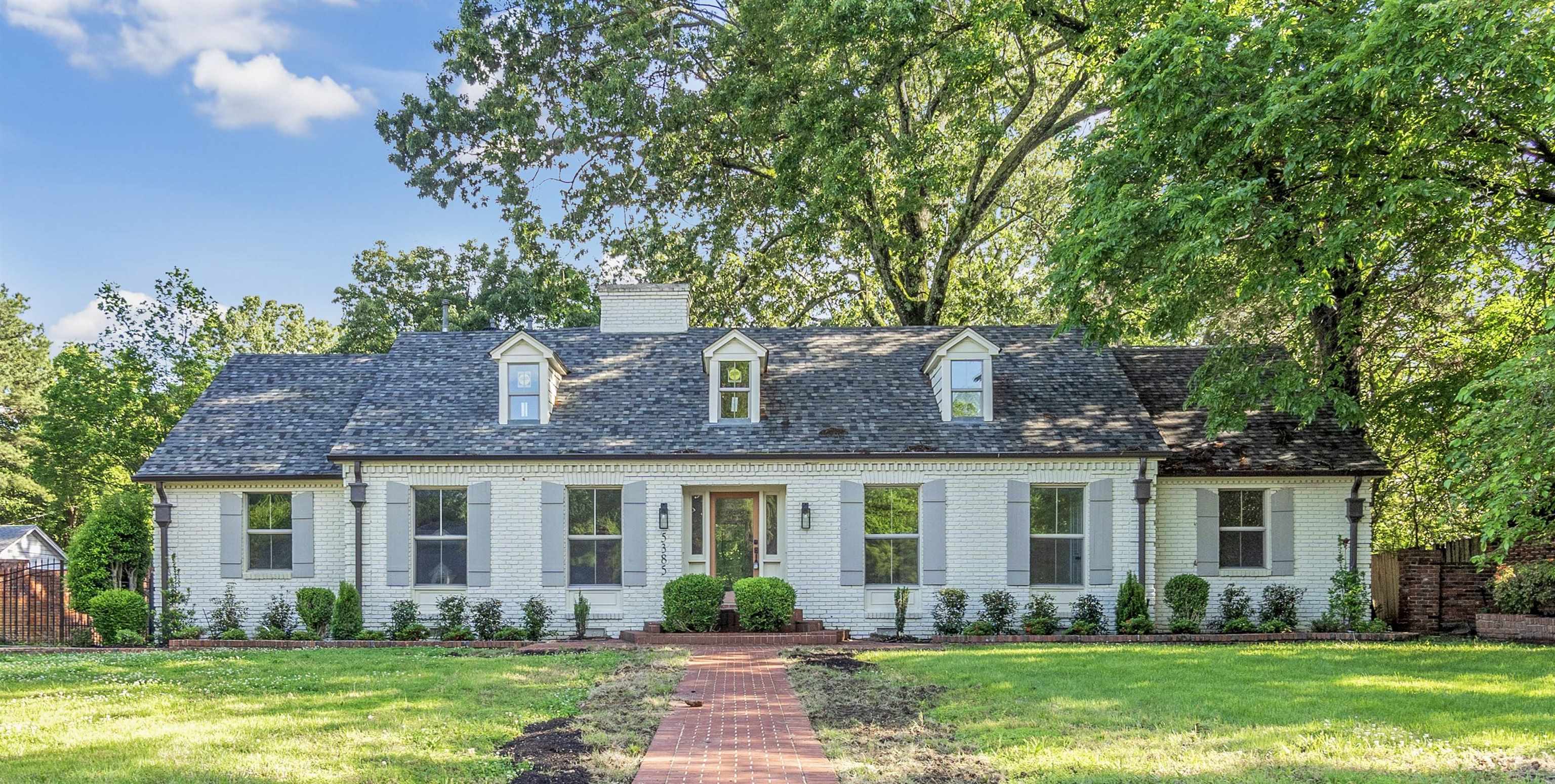 5385 Walnut Grove Road Memphis, TN 38120 - Photo 2 of 39 a front view of a house with garden