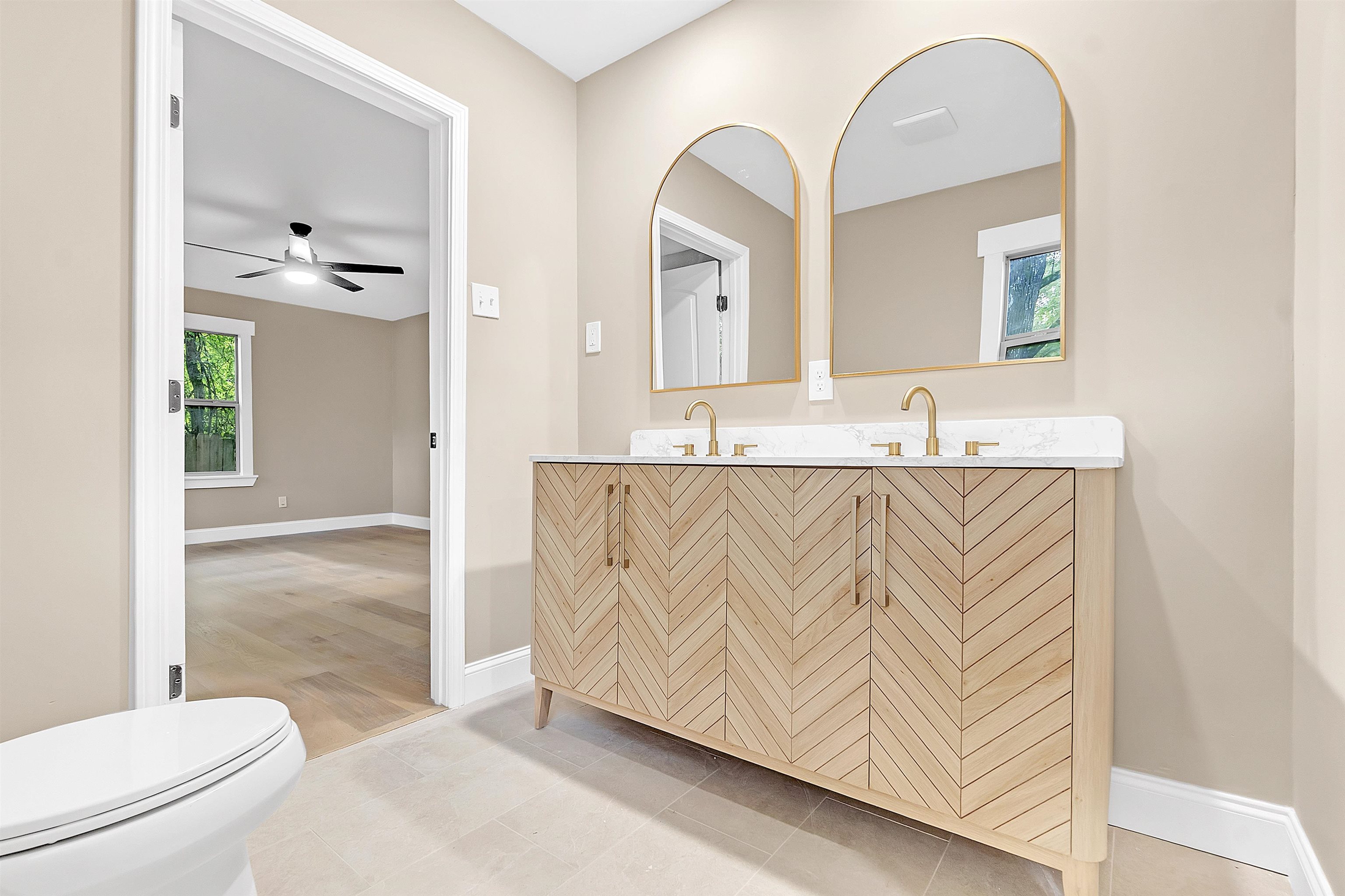 5385 Walnut Grove Road Memphis, TN 38120 - Photo 25 of 39 a en suite bathroom with a granite countertop sink and a mirror