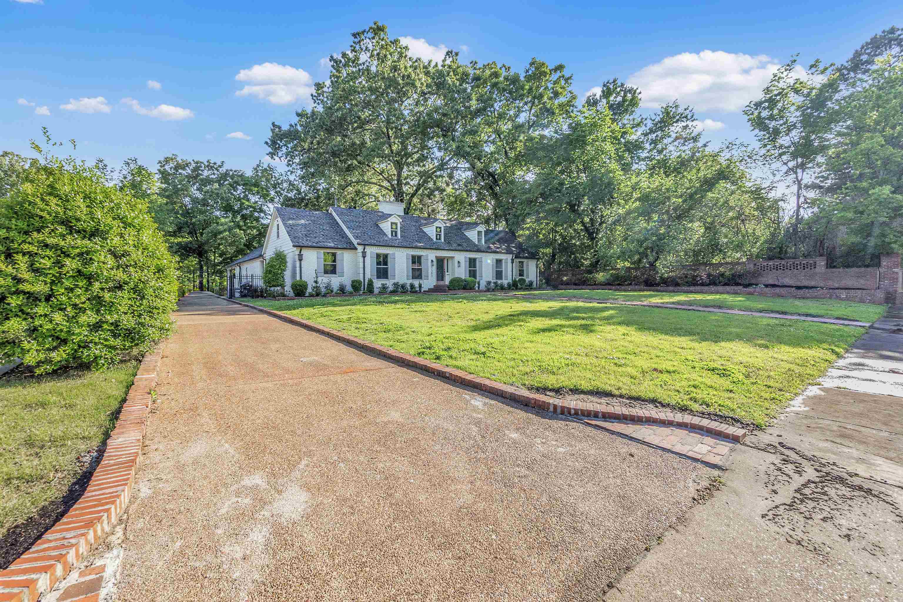 5385 Walnut Grove Road Memphis, TN 38120 - Photo 3 of 39 a view of swimming pool with a yard and large trees