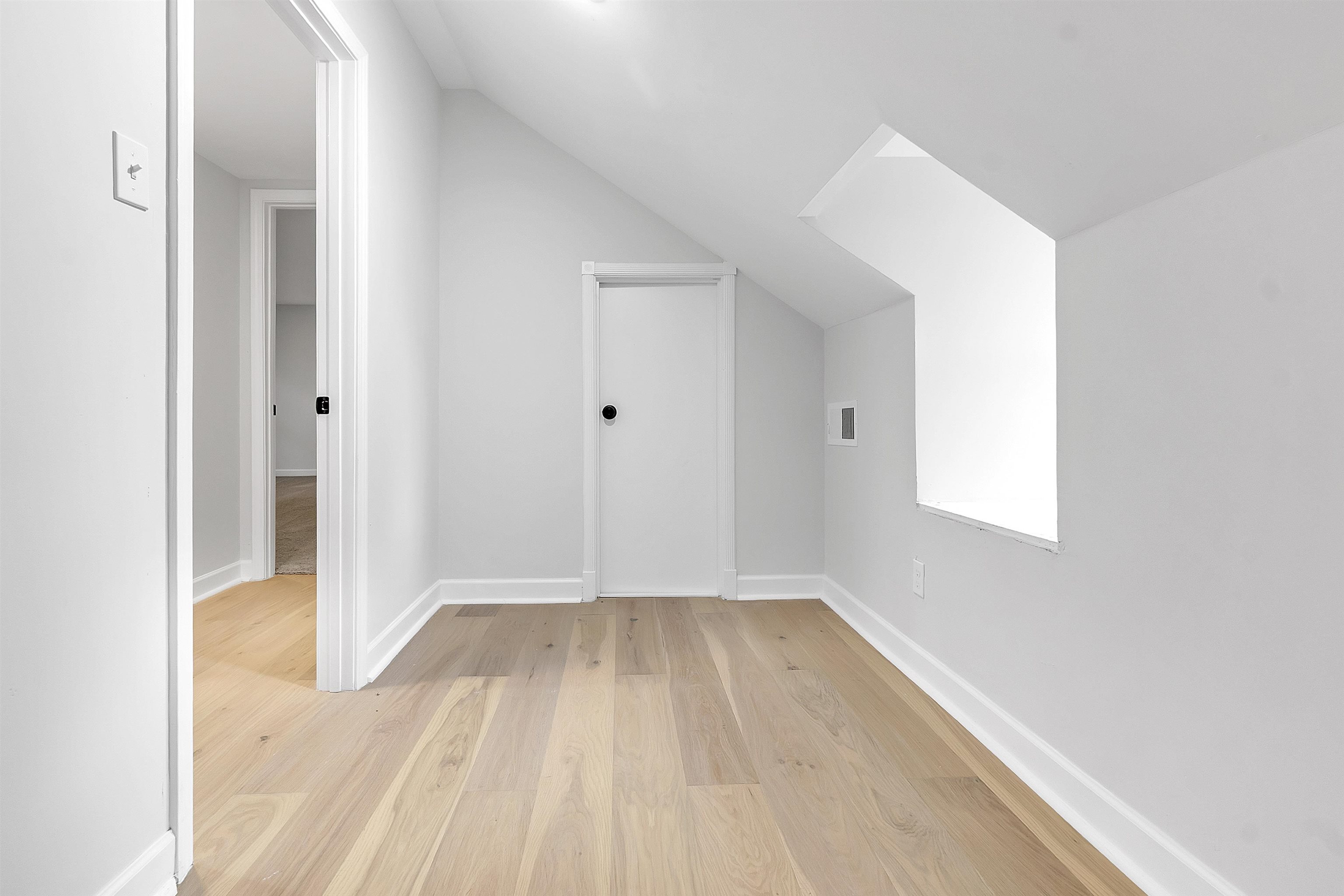 5385 Walnut Grove Road Memphis, TN 38120 - Photo 31 of 39 a view of a room that has wooden floor and a window