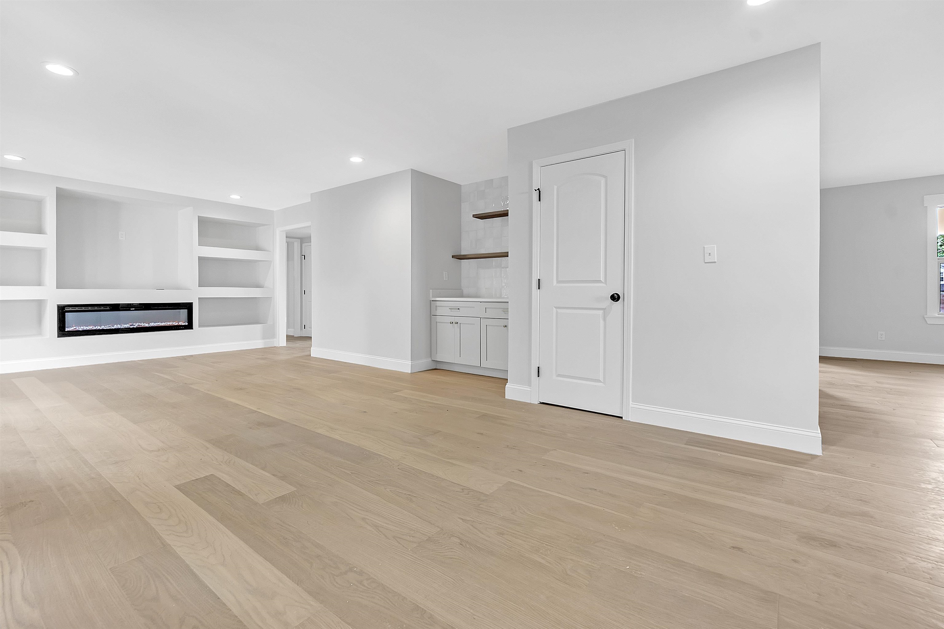 5385 Walnut Grove Road Memphis, TN 38120 - Photo 9 of 39 a view of empty room with wooden floor