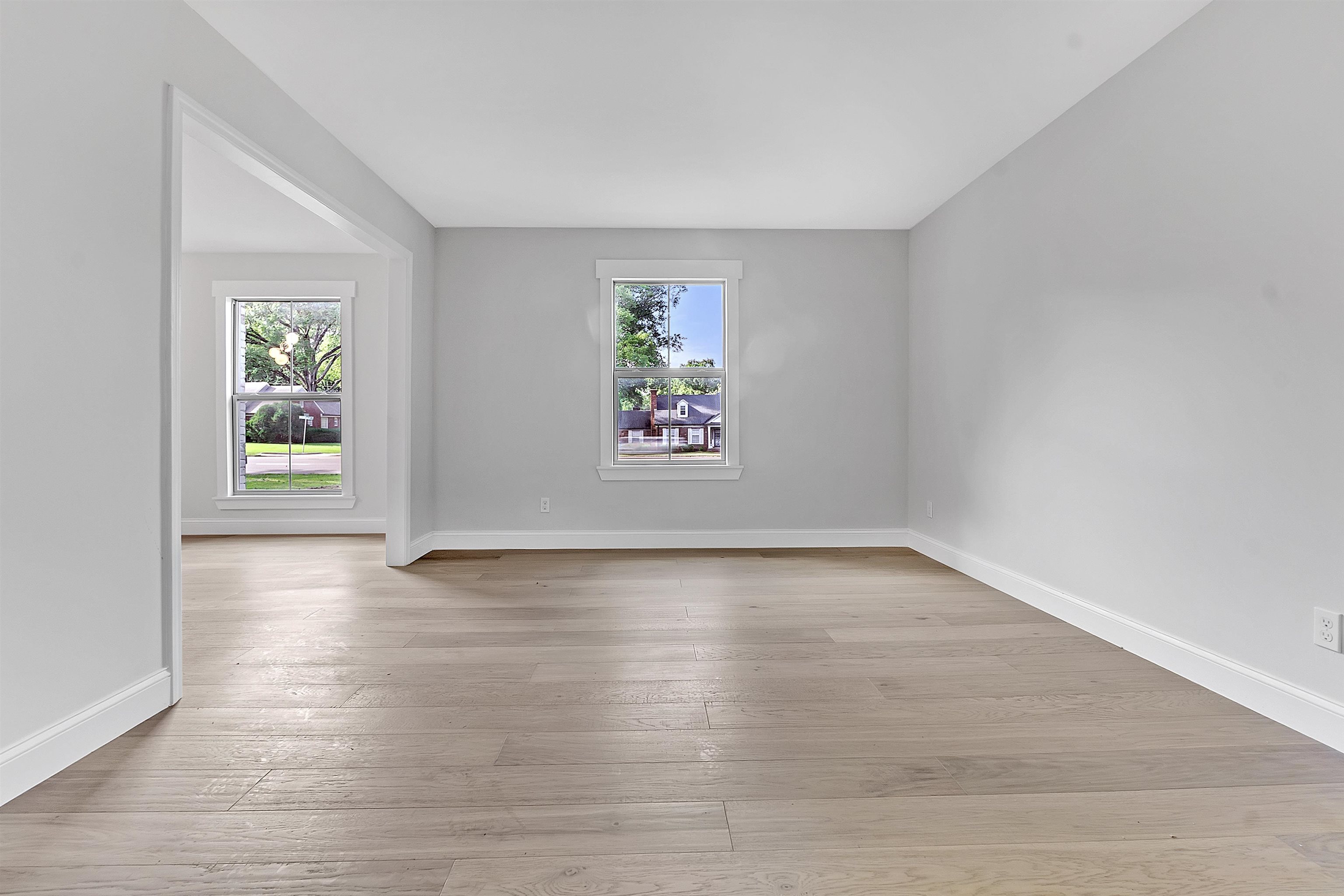 5385 Walnut Grove Road Memphis, TN 38120 - Photo 10 of 39 wooden floor in an empty room with a window