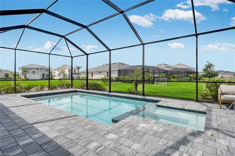 a view of a swimming pool with a porch
