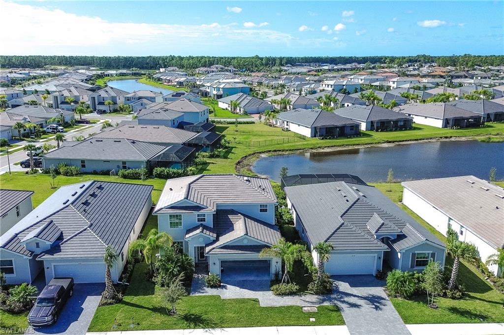 2318 Avocado Lane Naples, FL 34120 - Photo 2 of 47 an aerial view of residential houses with outdoor space and swimming pool