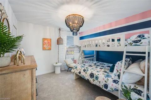 a bedroom with bed and window