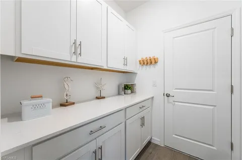 a kitchen with cabinets and a closet