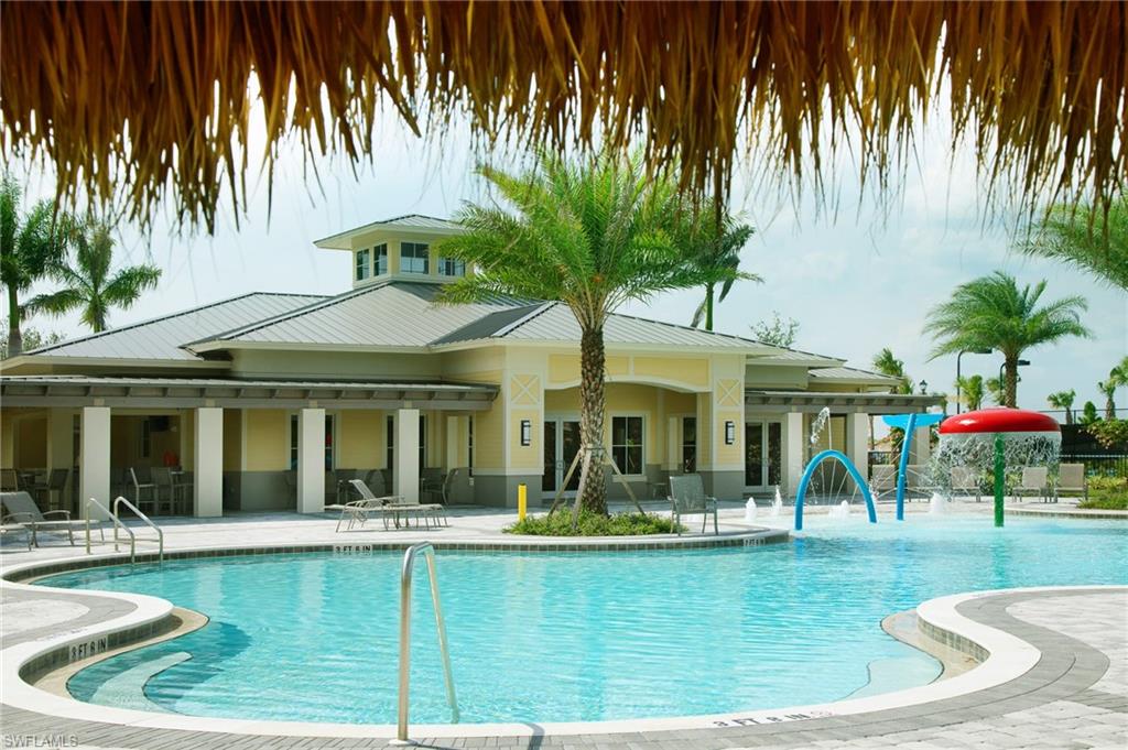 2318 Avocado Lane Naples, FL 34120 - Photo 44 of 47 a view of a swimming pool with a patio