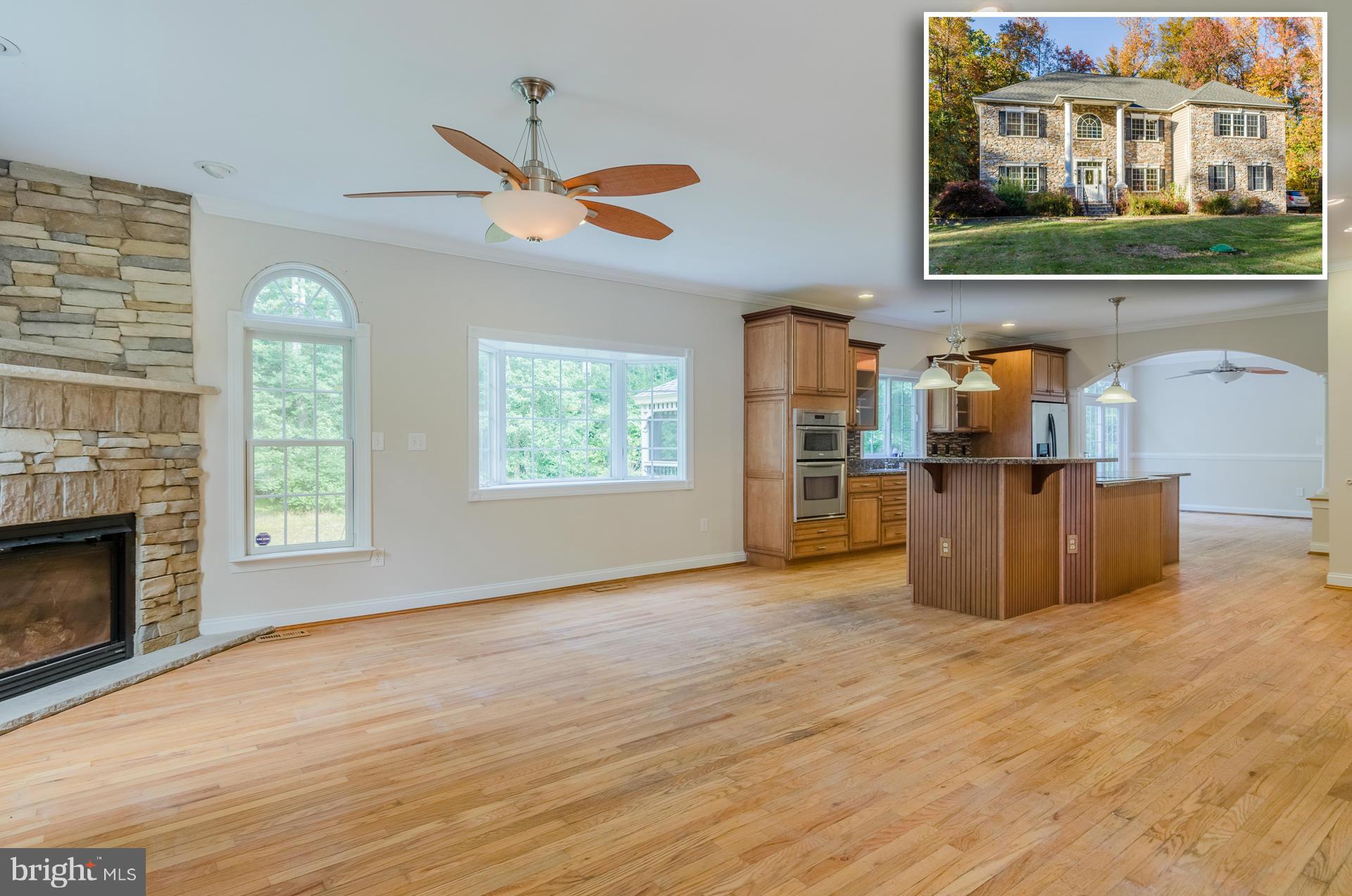 3902 Goose Harbor Road Middle River, MD 21220 - Photo 1 of 30 wooden floor fireplace and windows in an empty room