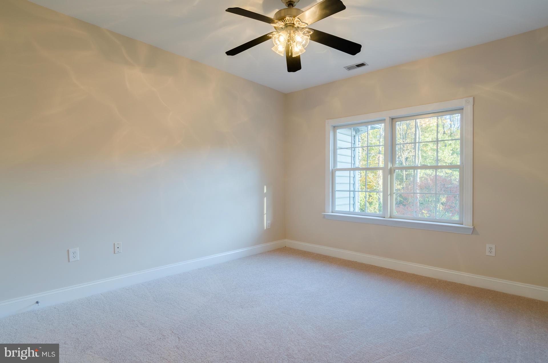 3902 Goose Harbor Road Middle River, MD 21220 - Photo 16 of 30 an empty room with a window and a fan