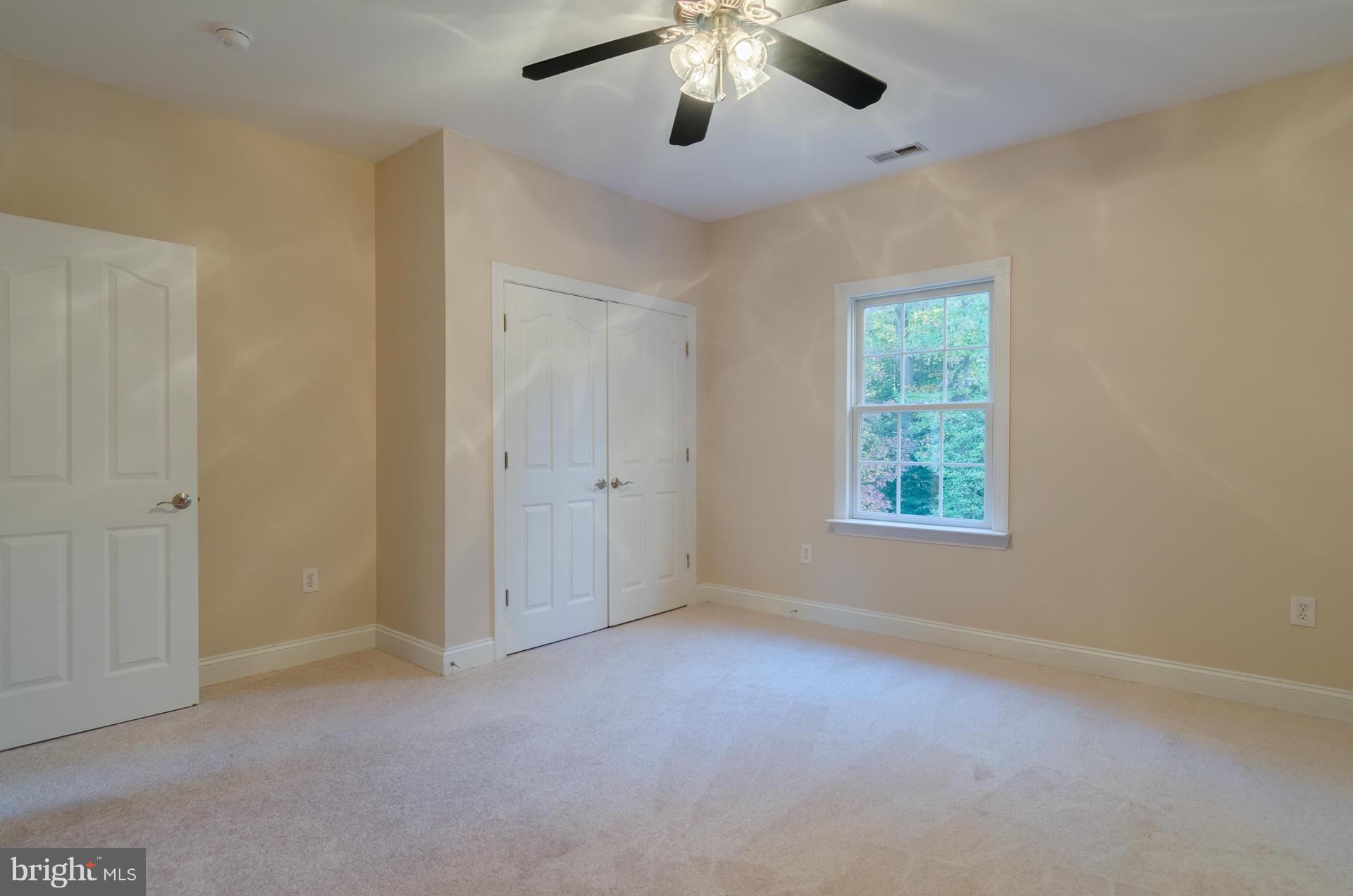 3902 Goose Harbor Road Middle River, MD 21220 - Photo 19 of 30 an empty room with windows and fan