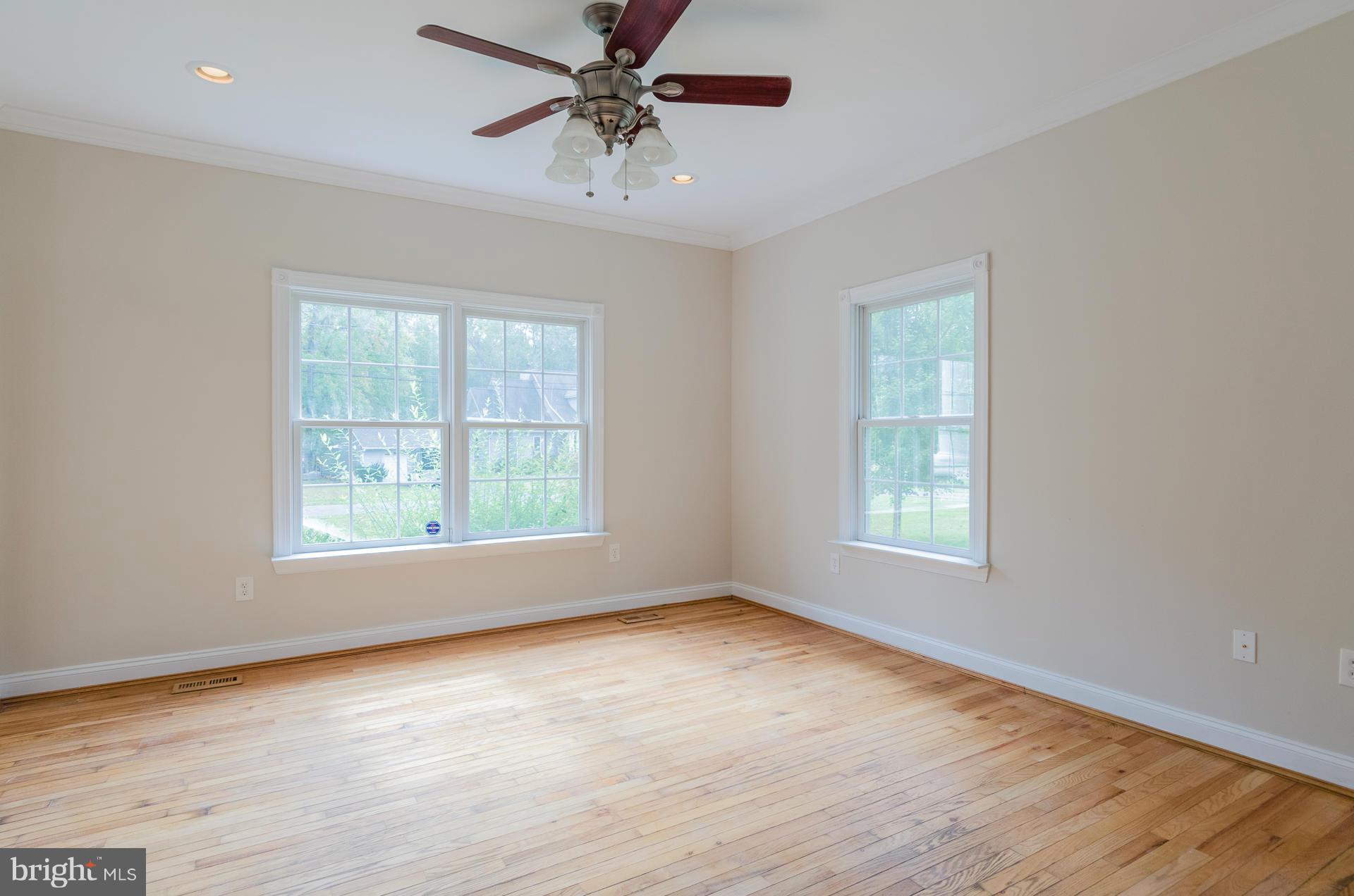 3902 Goose Harbor Road Middle River, MD 21220 - Photo 3 of 30 a view of an empty room with a window and wooden floor