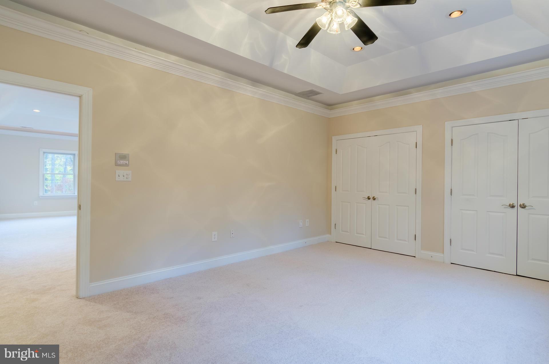 3902 Goose Harbor Road Middle River, MD 21220 - Photo 24 of 30 an empty room with a ceiling fan and carpet