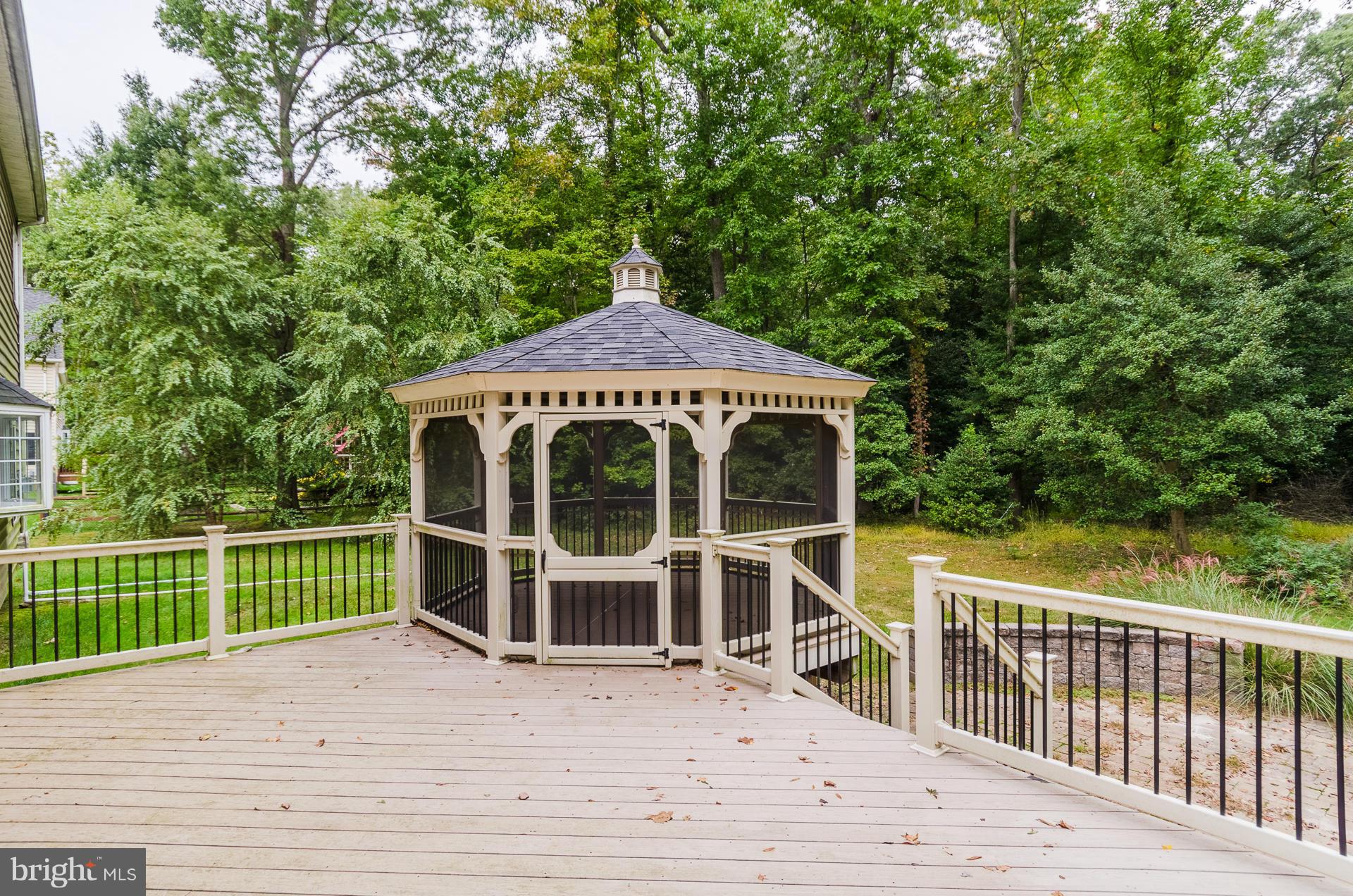3902 Goose Harbor Road Middle River, MD 21220 - Photo 25 of 30 a view of a wooden deck and a yard with lake view