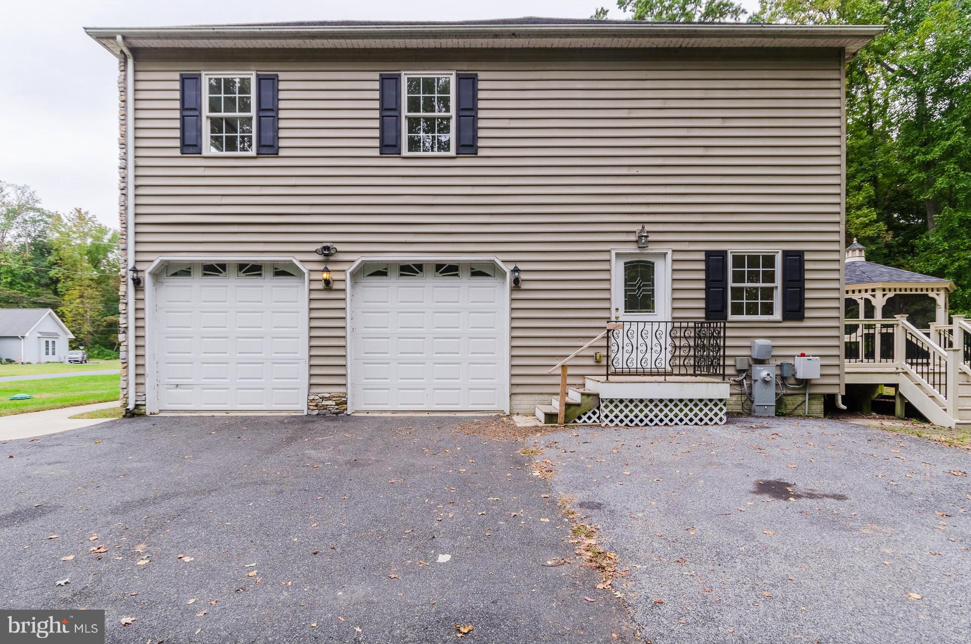 3902 Goose Harbor Road Middle River, MD 21220 - Photo 27 of 30 a view of a house with a yard and garage