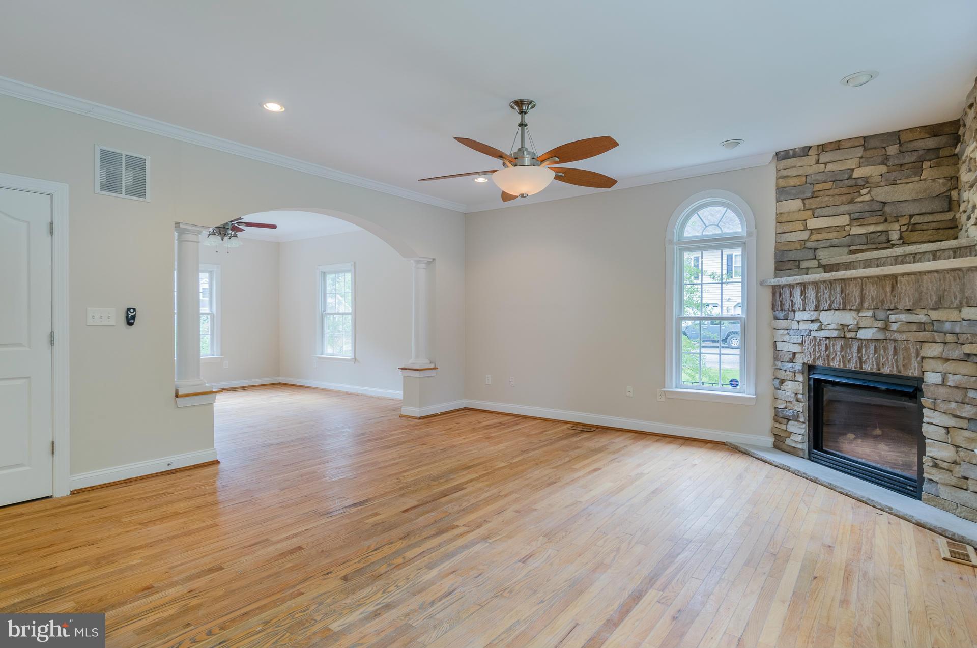 3902 Goose Harbor Road Middle River, MD 21220 - Photo 5 of 30 a view of an empty room with a fireplace and a window