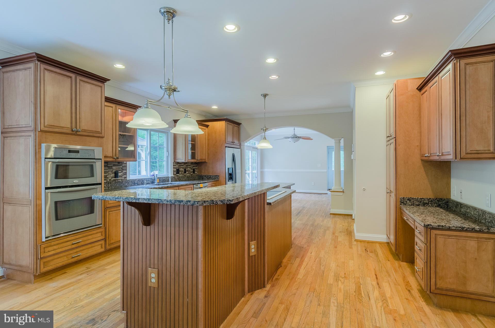 3902 Goose Harbor Road Middle River, MD 21220 - Photo 6 of 30 a kitchen with stainless steel appliances granite countertop a stove a sink and a refrigerator
