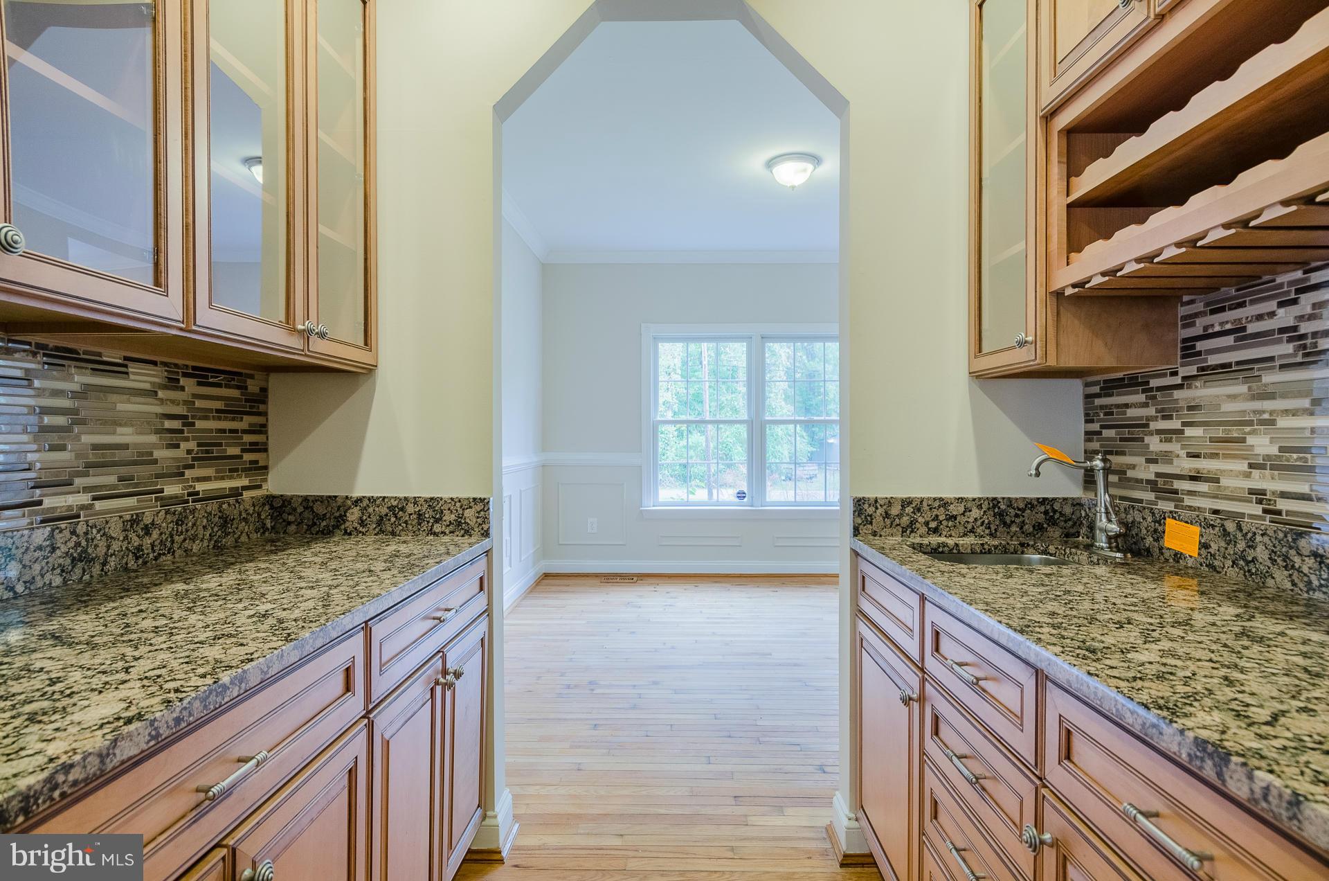 3902 Goose Harbor Road Middle River, MD 21220 - Photo 10 of 30 a kitchen with granite countertop a sink and a stove