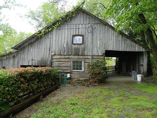 6821 Burkitt Road Antioch, TN 37013 - Photo 14 of 20 OLD LOG BARN WITH STALLS, LOFT, AND WORKSHOP AREA