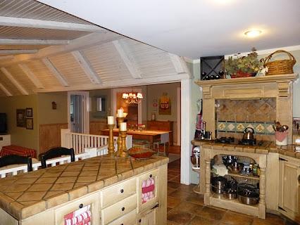 6821 Burkitt Road Antioch, TN 37013 - Photo 5 of 20 OPEN KITCHEN WITH ISLAND AND BUILT-IN COOKTOP/OVEN, TILE COUNTERS