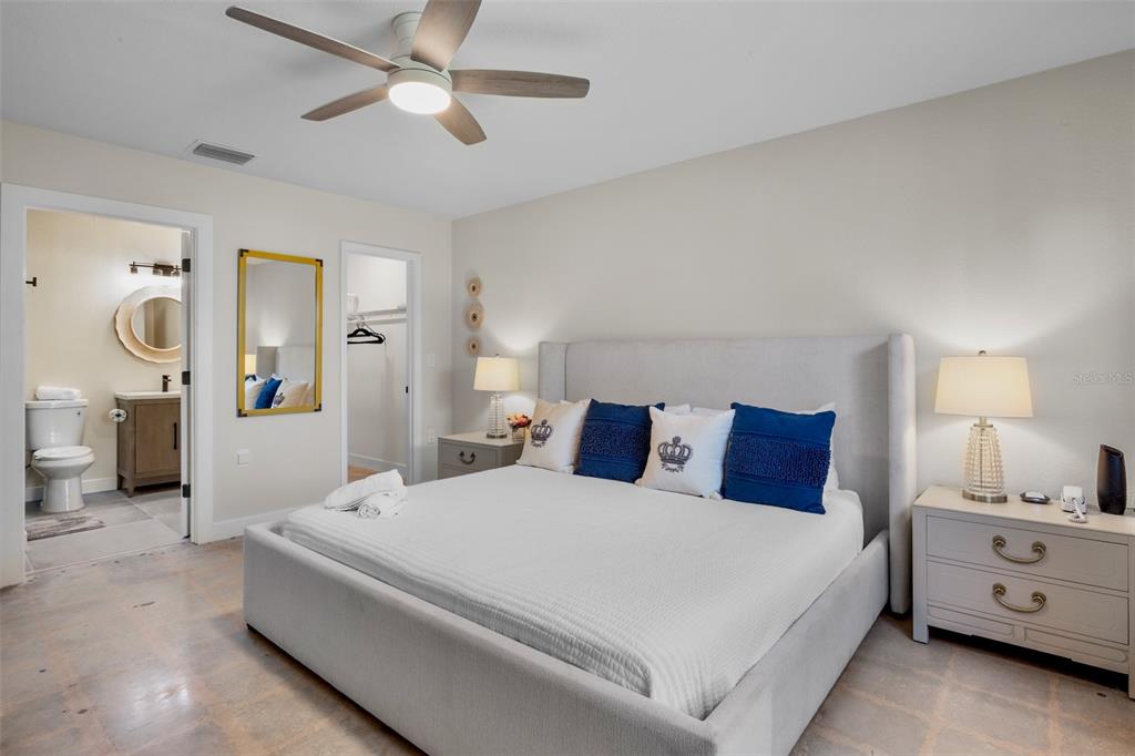 442 62nd Street Holmes Beach, FL 34217 - Photo 11 of 29 a bed room with a bed and a chandelier