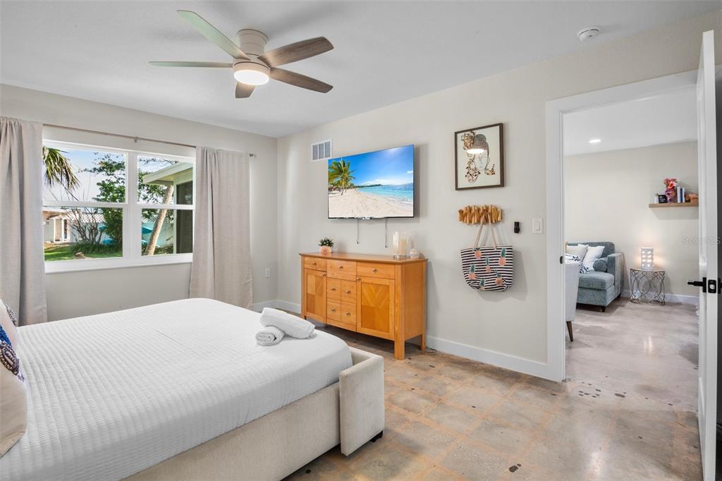 442 62nd Street Holmes Beach, FL 34217 - Photo 12 of 29 a bedroom with a bed and a painting on the wall