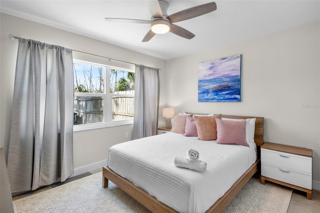 442 62nd Street Holmes Beach, FL 34217 - Photo 14 of 29 a bedroom with a large bed and a window