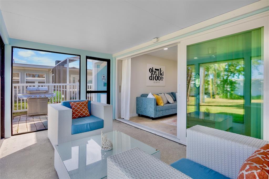 442 62nd Street Holmes Beach, FL 34217 - Photo 18 of 29 a living room with couch and a large window