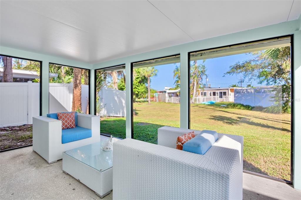 442 62nd Street Holmes Beach, FL 34217 - Photo 20 of 29 a living room with furniture and a large window