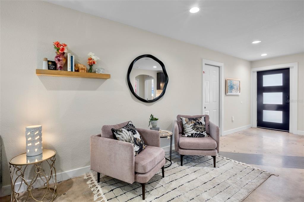 442 62nd Street Holmes Beach, FL 34217 - Photo 2 of 29 a living room with furniture and window