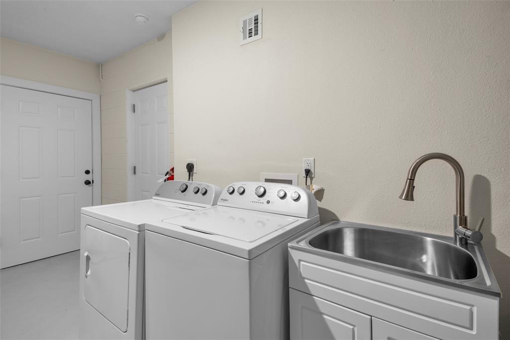 442 62nd Street Holmes Beach, FL 34217 - Photo 22 of 29 a utility room with dryer and washer