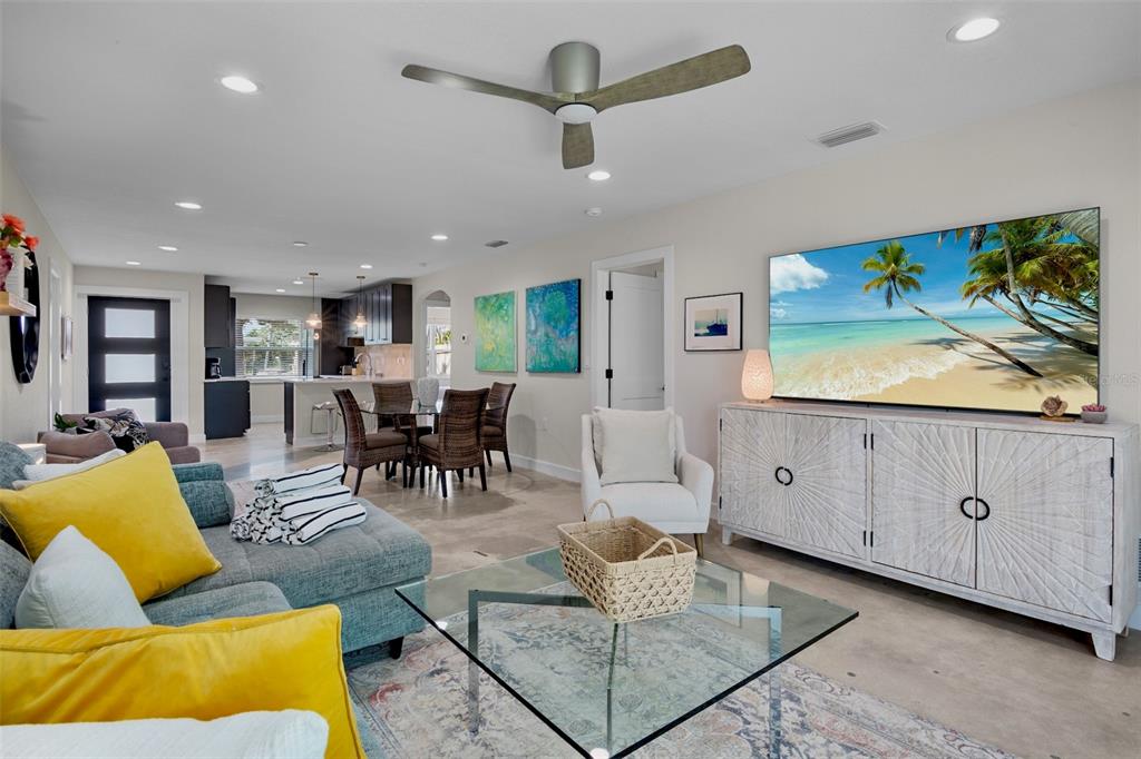 442 62nd Street Holmes Beach, FL 34217 - Photo 7 of 29 a living room with furniture kitchen view and a flat screen tv