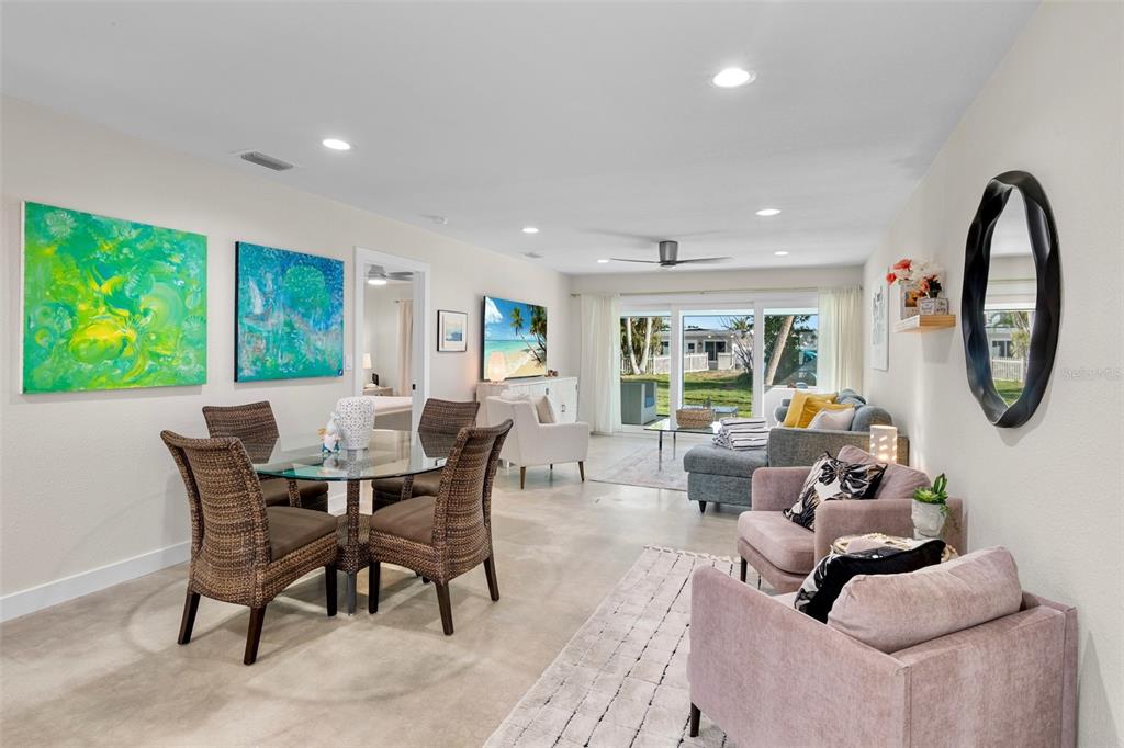 442 62nd Street Holmes Beach, FL 34217 - Photo 8 of 29 a living room with furniture a window and a dining table