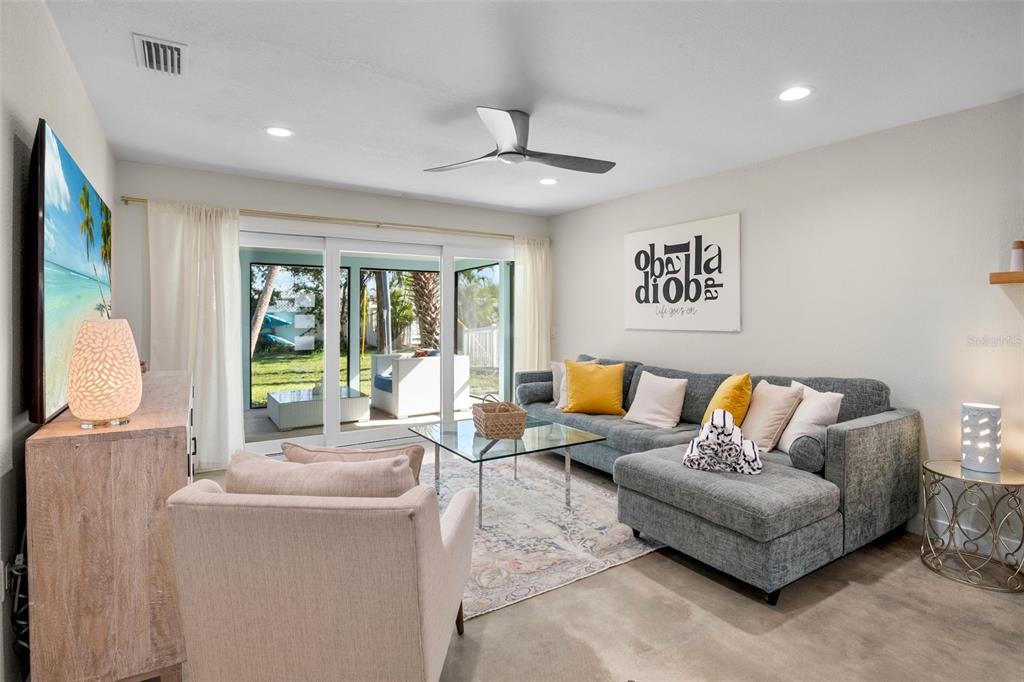 442 62nd Street Holmes Beach, FL 34217 - Photo 9 of 29 a living room with furniture and a large window