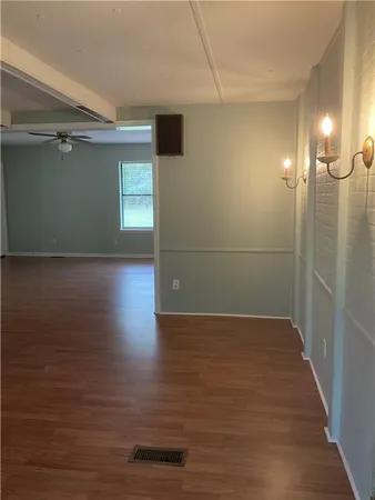 a view of a livingroom with wooden floor
