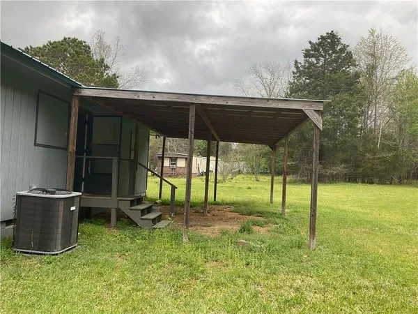 a view of backyard with cabin