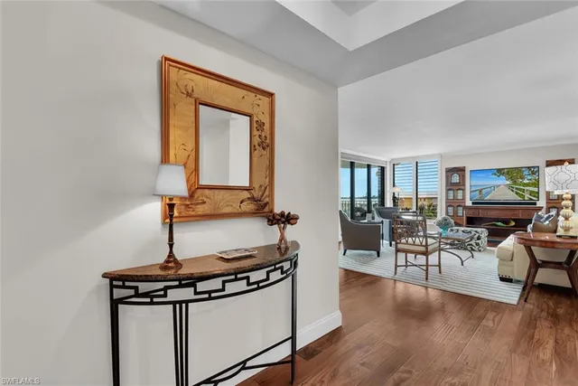 a view of a livingroom with furniture and hardwood floor