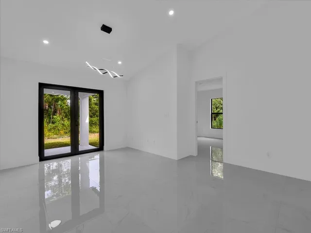 a view of an empty room with a window