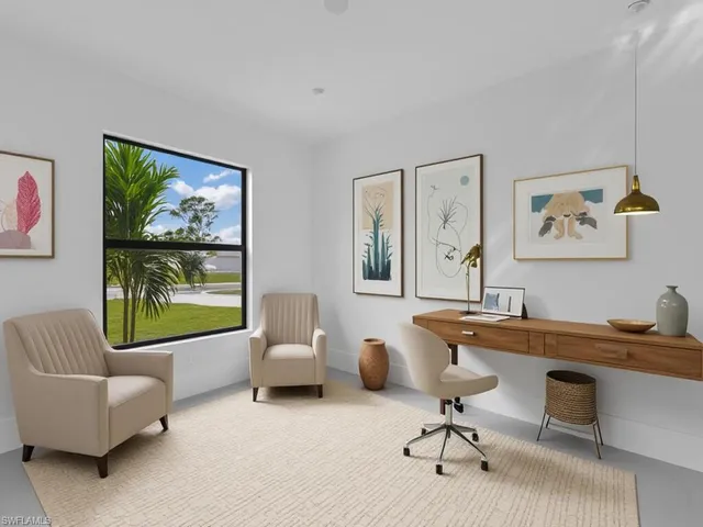 a view of a workspace with a window and couch