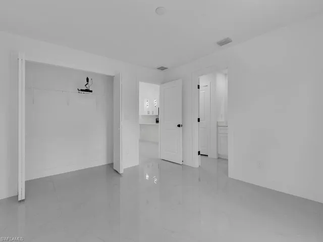 a bathroom with a sink toilet a mirror and shower