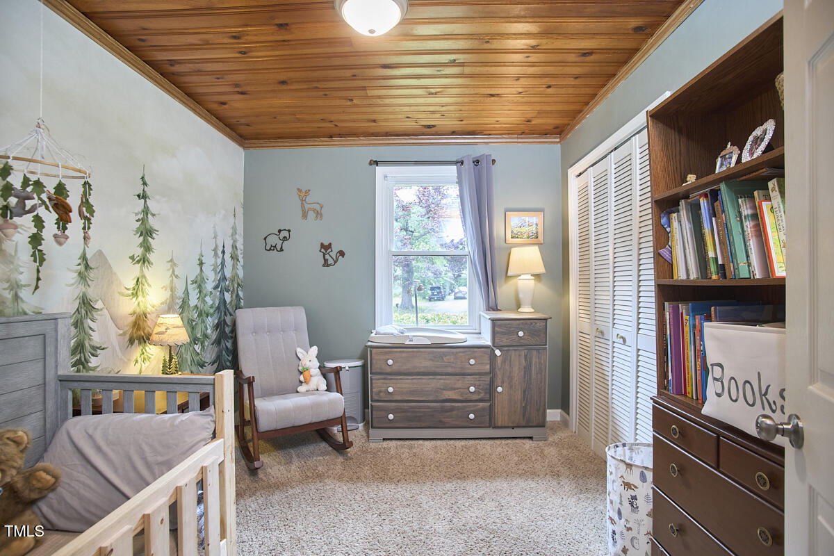 909 Goodwin Road Durham, NC 27712 - Photo 16 of 52 a living room with furniture and a window