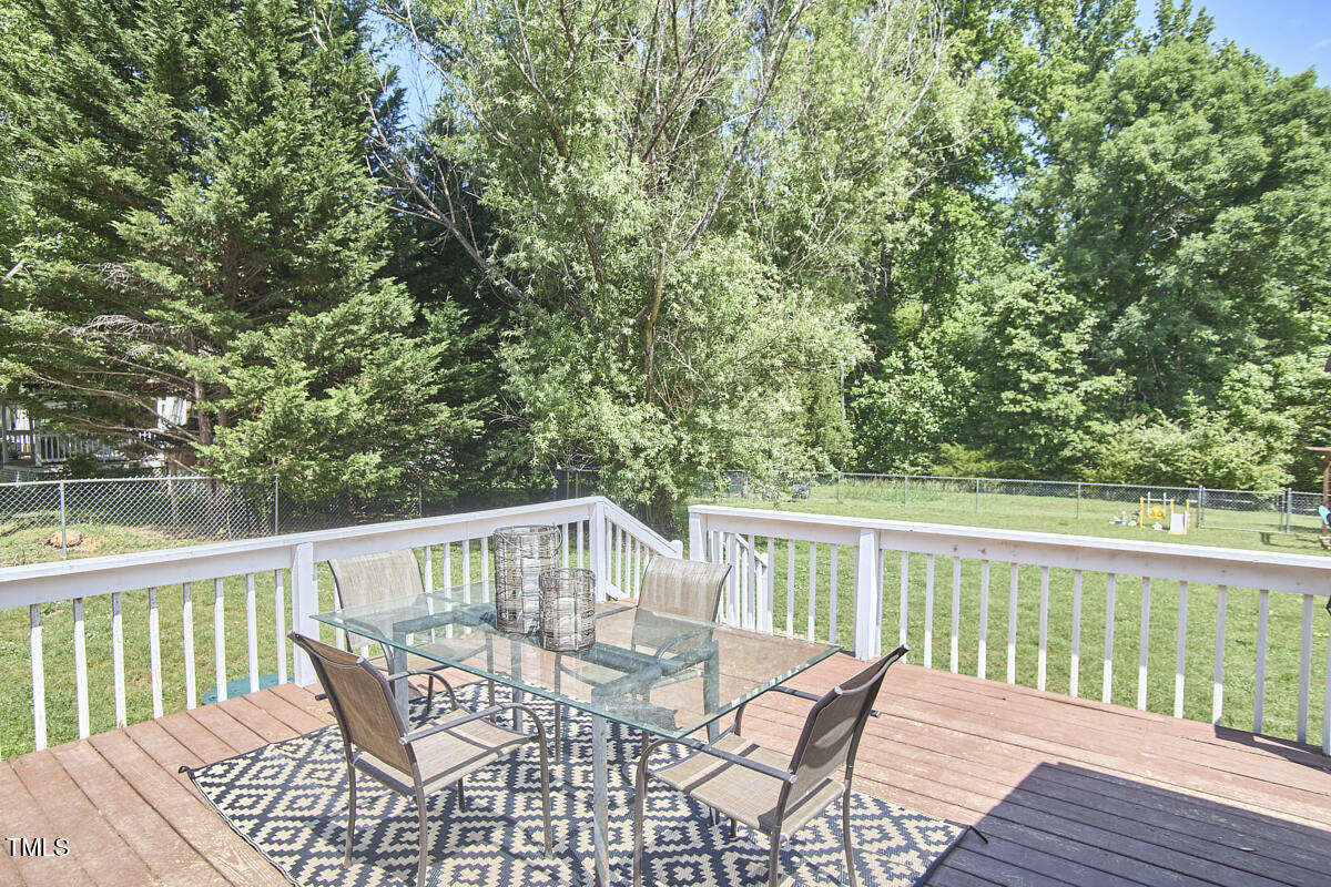 909 Goodwin Road Durham, NC 27712 - Photo 20 of 52 a view of a chair and table on the deck