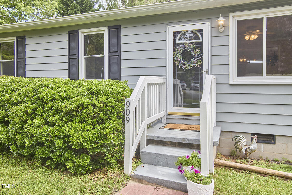 909 Goodwin Road Durham, NC 27712 - Photo 3 of 52 a front view of a house with a porch
