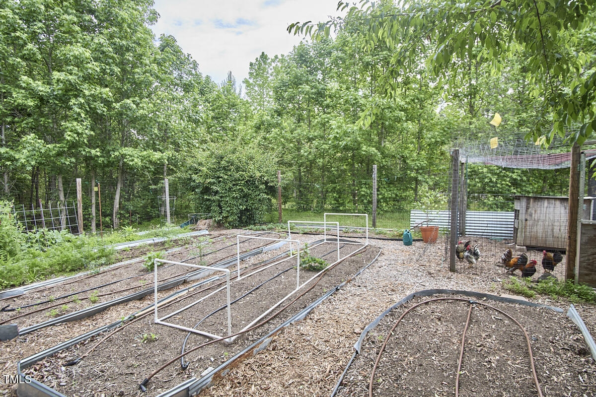 909 Goodwin Road Durham, NC 27712 - Photo 40 of 52 a view of a backyard with sitting area