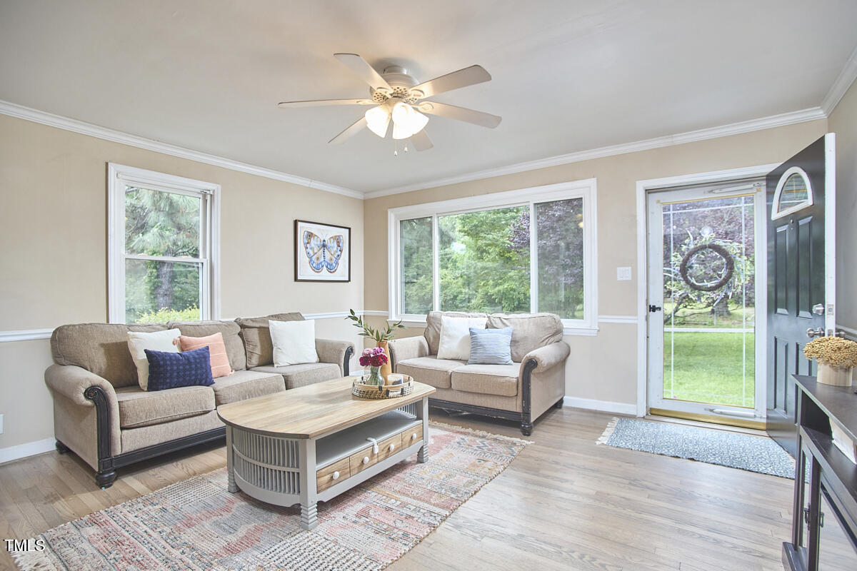 909 Goodwin Road Durham, NC 27712 - Photo 5 of 52 a living room with furniture and a large window