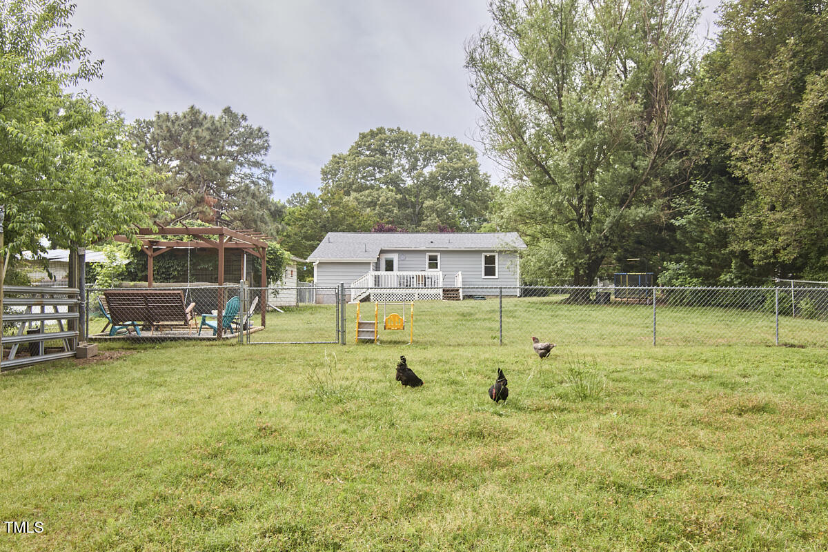 909 Goodwin Road Durham, NC 27712 - Photo 51 of 52 a swimming pool with outdoor seating and yard