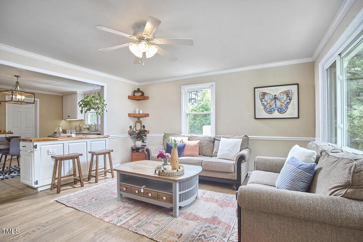 909 Goodwin Road Durham, NC 27712 - Photo 6 of 52 a living room with furniture and a large window