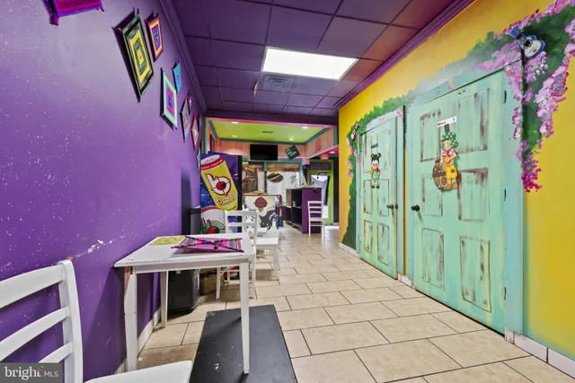 a view of a hallway with a red and white wall