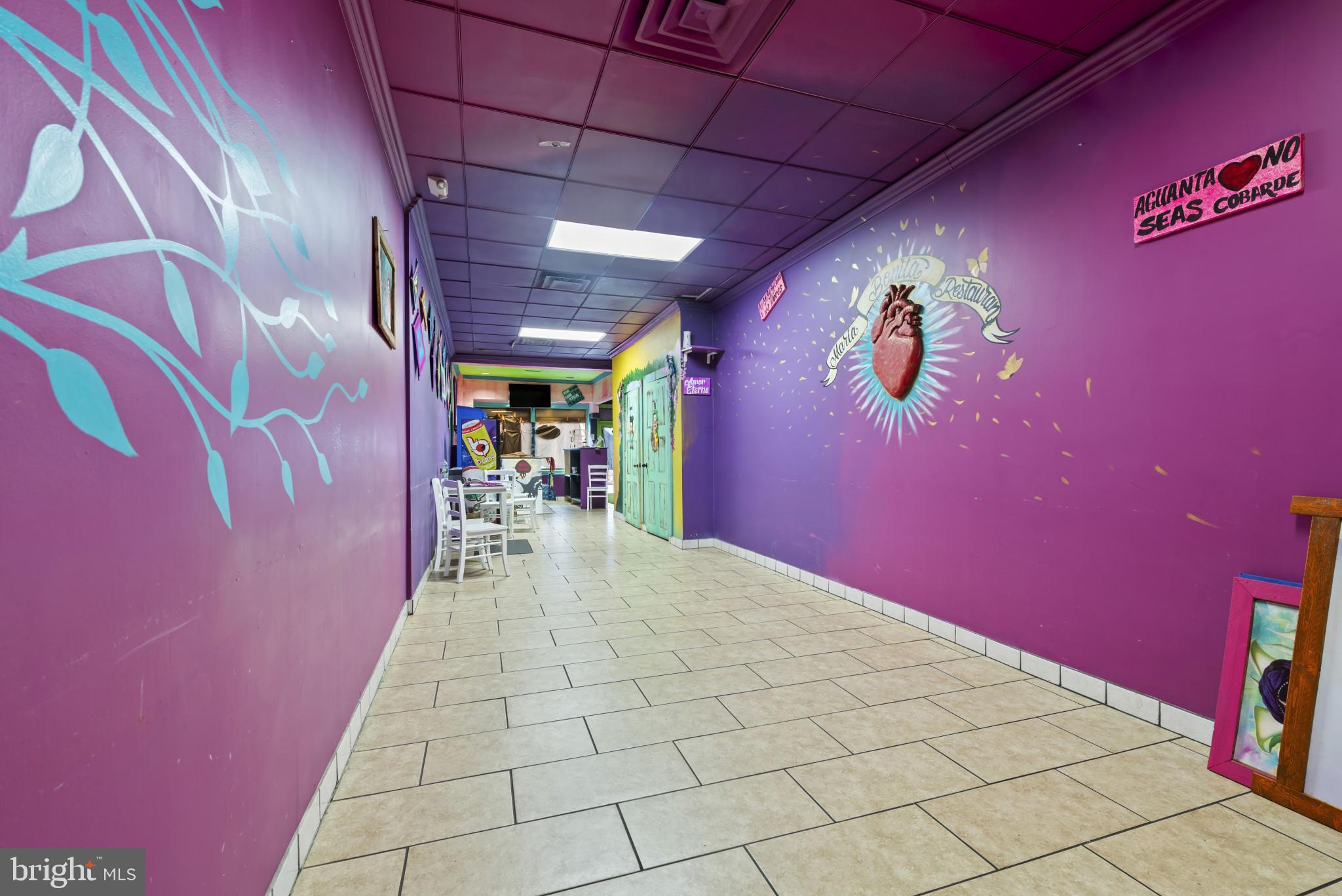 3418 Eastern Avenue Baltimore, MD 21224 - Photo 15 of 53 a view of a hallway with a red and white wall